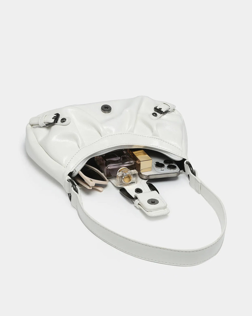 What fits inside the Women's fashionable Vegan Leather Shoulder White Bag with Buckle Details