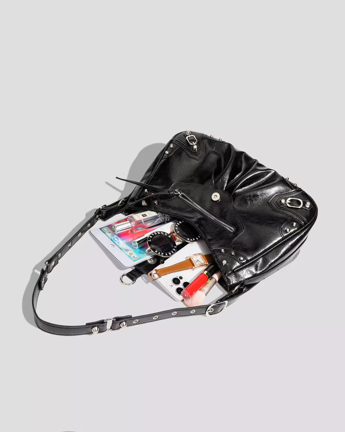 What fits inside Black Studded Y2K Statement Vegan Leather Handbag with an adjustable single strap