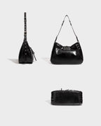 Side, back, and bottom views of the Black Studded Y2K Statement Vegan Leather Handbag with adjustable single strap