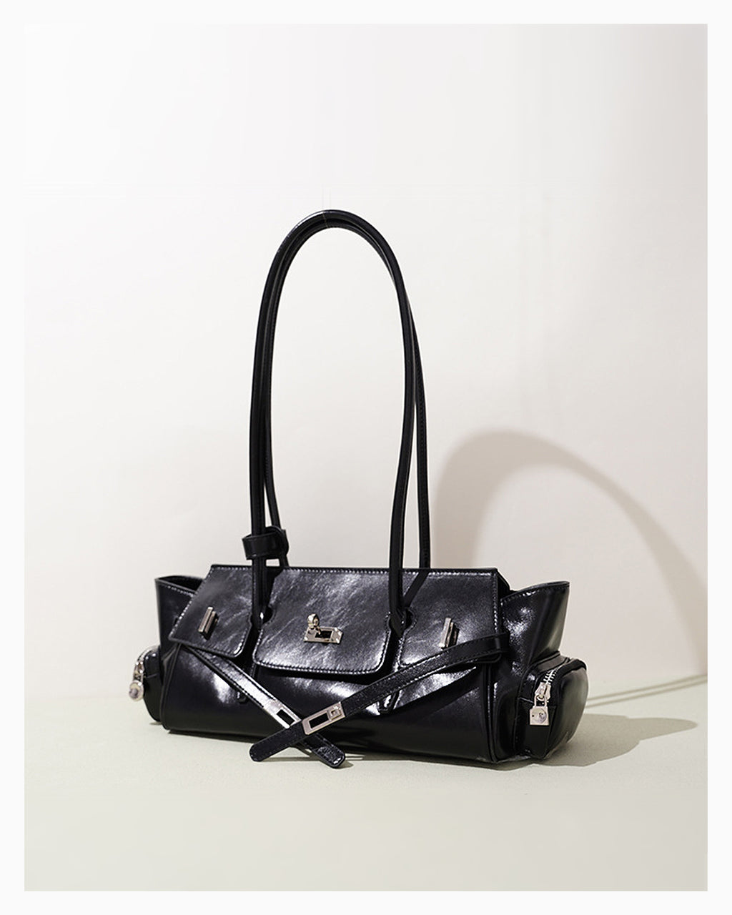 Woman's Genuine Leather Shoulder Baguette Black Bag with zippered side pockets and turn-lock closure