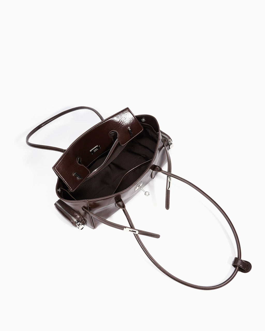 Compartment details of the Genuine Leather Shoulder Baguette Bag with zippered side pockets and turn-lock closure