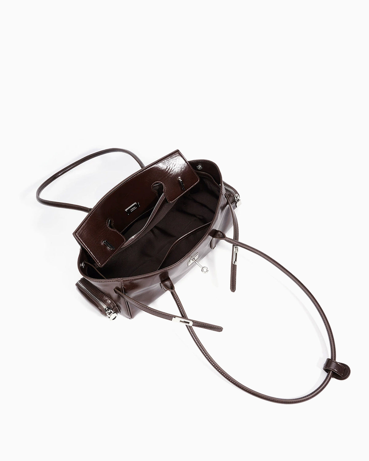 Compartment details of the Genuine Leather Shoulder Baguette Bag with zippered side pockets and turn-lock closure