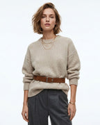 A woman modeling a beige ribbed knit sweater with a caramel-colored Genuine Suede Leather Belt with Silver Rectangular Buckle, paired with dark gray trousers | BUCKLE Collective