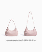 Adjustable strap details of the Genuine Leather Crescent Baguette Shoulder Bag in a Peach Pink Color