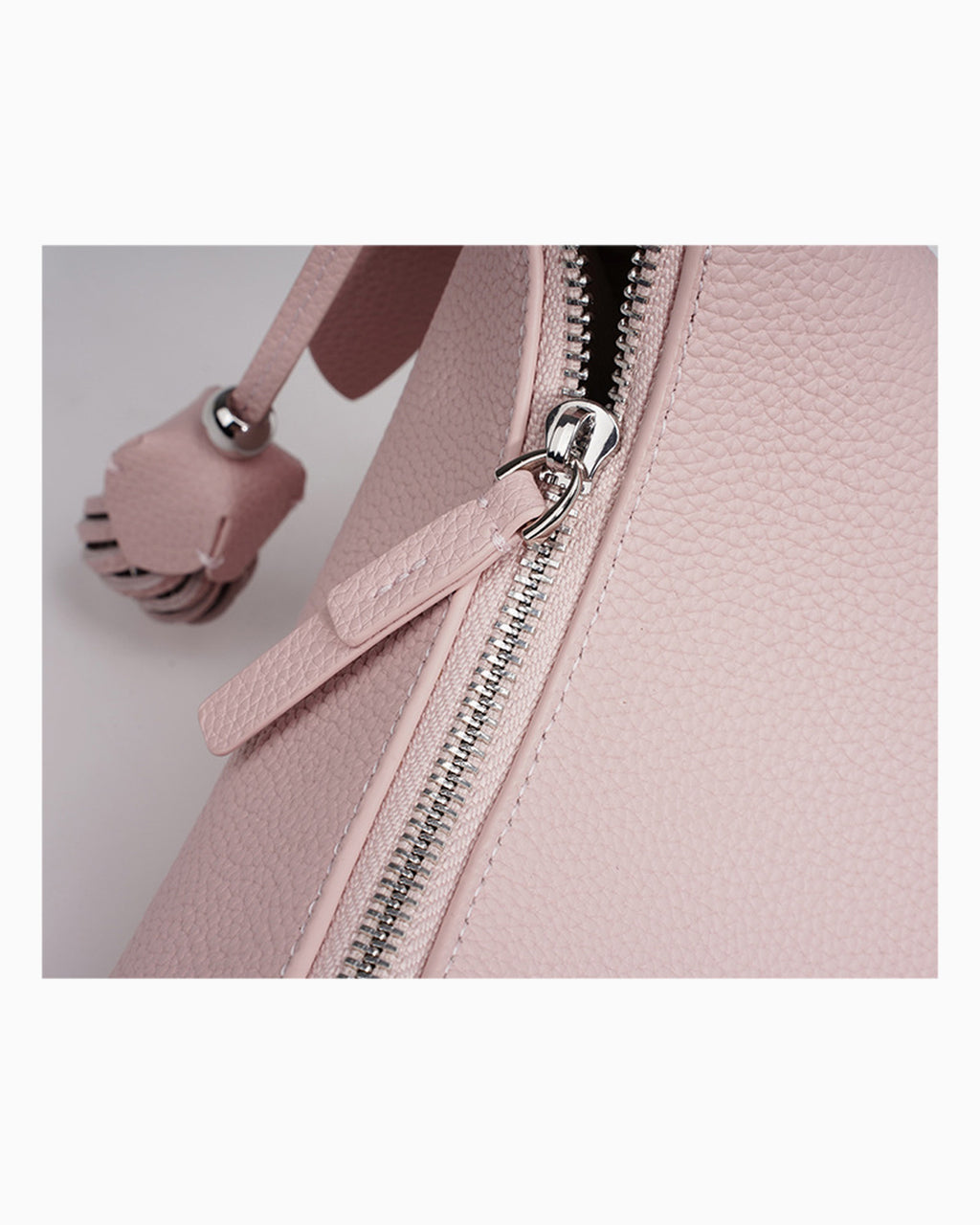 Zipper details of the Genuine Leather Crescent Baguette Shoulder Bag in a Peach Pink Color