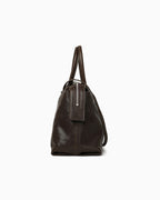 Side view of the Large Coffee-brown Leather Pillow Handbag with Shoulder Straps | BUCKLE Collective
