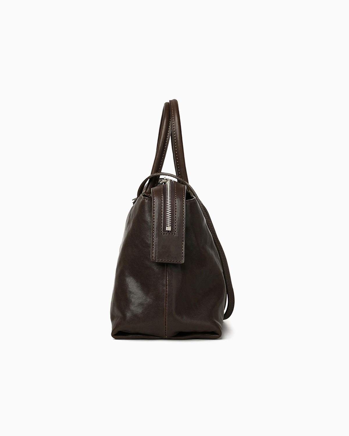 Side view of the Large Coffee-brown Leather Pillow Handbag with Shoulder Straps | BUCKLE Collective
