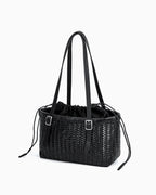 Side view of the Women's Trendy Genuine Leather Woven Tote Bucket Bag with Buckle Details, Black Color