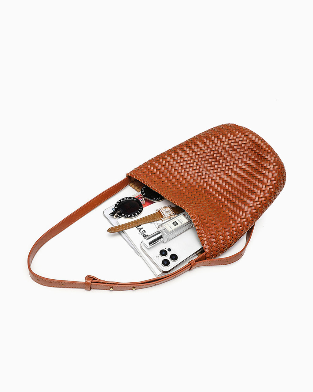 What fits inside the Trendy Woven Vegan Leather Bucket Bag with Adjustable Strap in Rich Caramel Color