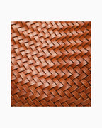 Leather texture of the Woven Vegan Leather Bucket Bag with Adjustable Strap
