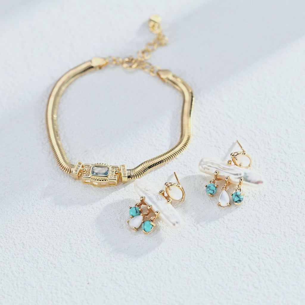 Art Deco-inspired snake chain bracelet with a rectangular cubic zirconia centre and sparkling side accents, showing the flexible chain and geometric setting.”