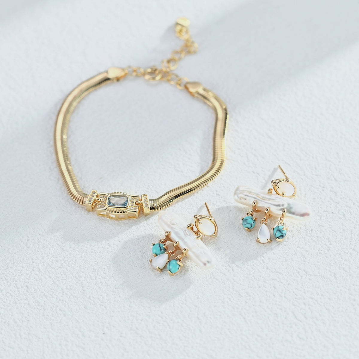 Art Deco-inspired snake chain bracelet with a rectangular cubic zirconia centre and sparkling side accents, showing the flexible chain and geometric setting.”