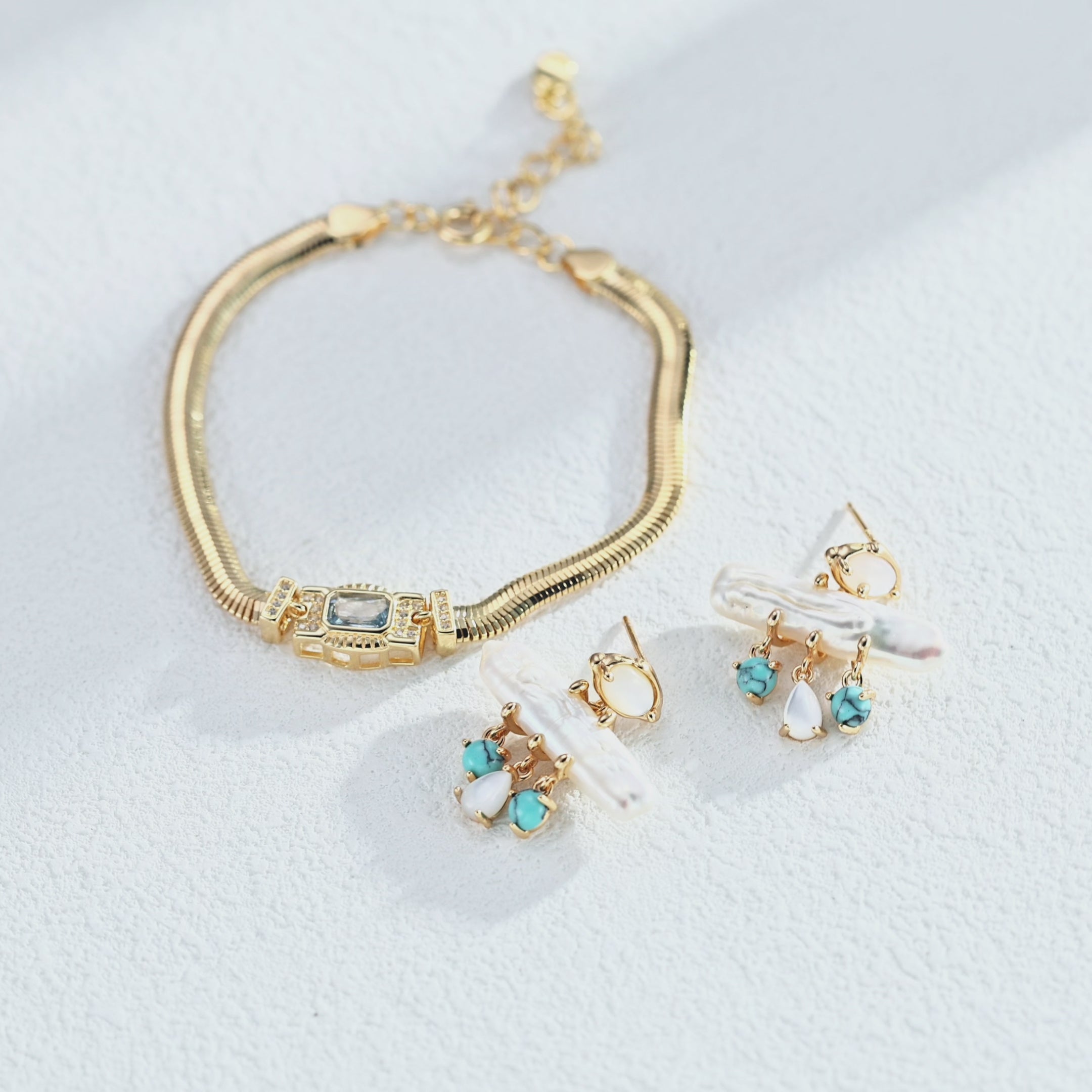 Art Deco-inspired snake chain bracelet with a rectangular cubic zirconia centre and sparkling side accents, showing the flexible chain and geometric setting.”