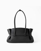 The back of a Black Structured Shoulder Tote with Buckle Strap by BUCKLE Collective