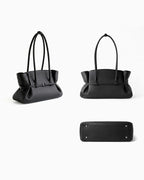 An angle, back abd bottom views of a Black Structured Shoulder Tote with Buckle Strap by BUCKLE Collective